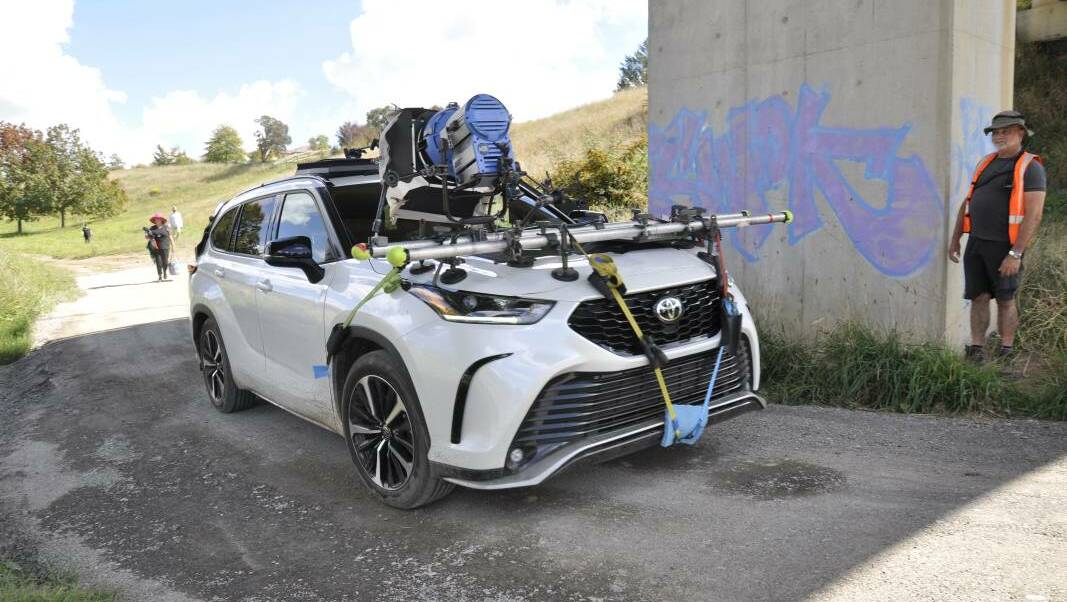 CENTRE OF ATTENTION: A Sydney film crew turned heads on Thursday morning with the shooting of an ad for Toyota around Marsden Weir and the Goulburn waterworks. Picture: Louise Thrower.
