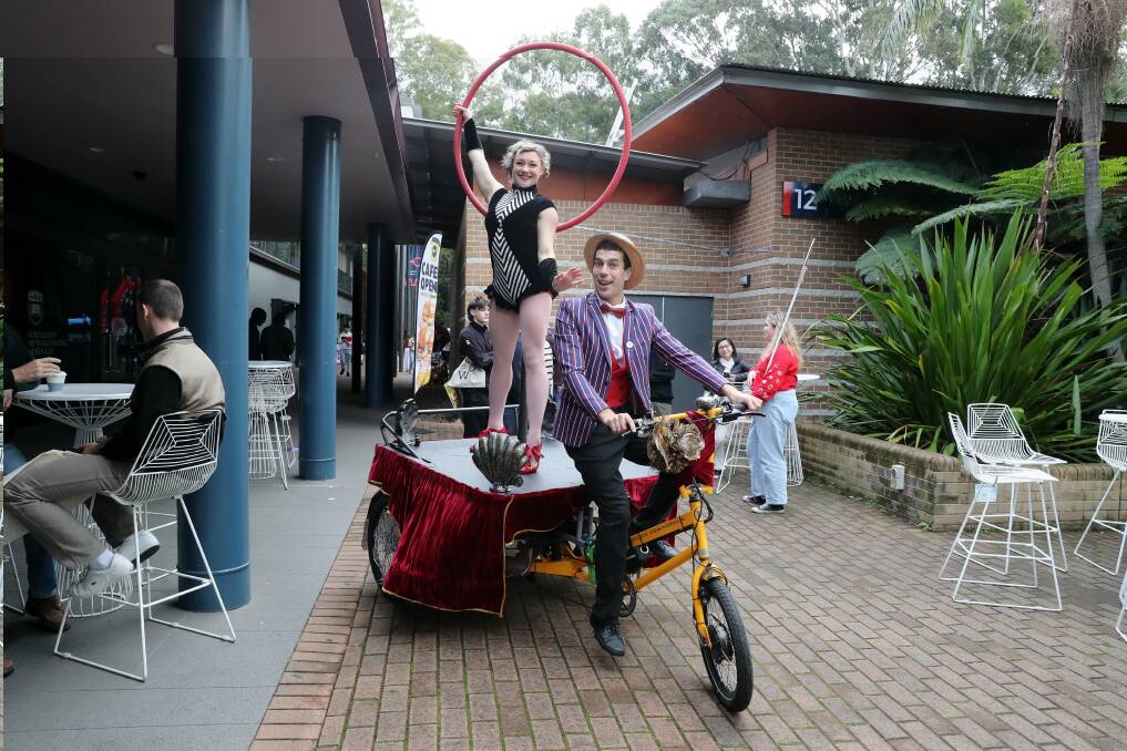 An aerial hoop artist performed while travelling through the University of Wollongong campus on June 22. Picture by Sylvia Liber