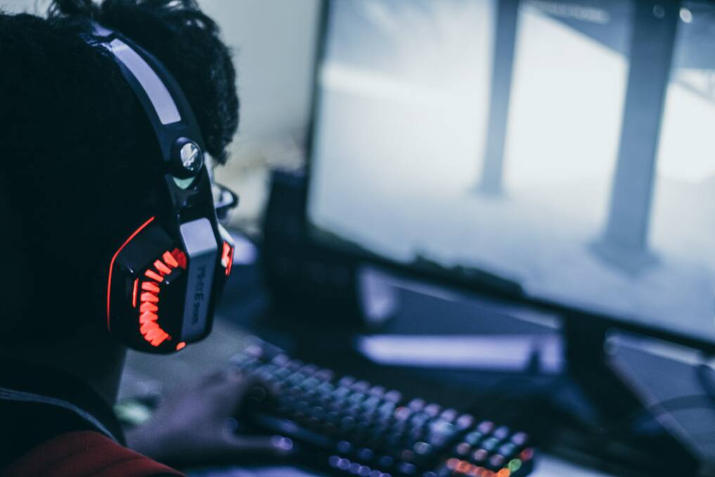 The Australian Federal Police have issued a warning that extremist groups are using gaming platforms to target young people. Picture by Frederick Tendong via Unsplash.