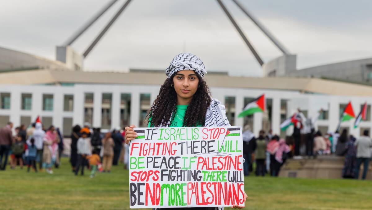 Alma Elhoufy joined Palestine supporters rallying outside Parliament House on Saturday to protest Israel's bombardment of Gaza. Picture by Sitthixay Ditthavong