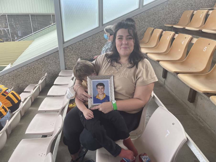 Georgie Burt with a picture of her son Zane Mellor at the Hillcrest AFL tribute match earlier this year. File picture.