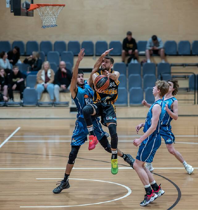 Shoalhaven Tigers' Jack Callaghan driving to the basket against the Goulburn Bears last season. Picture by Shoalhaven Basketball Association 