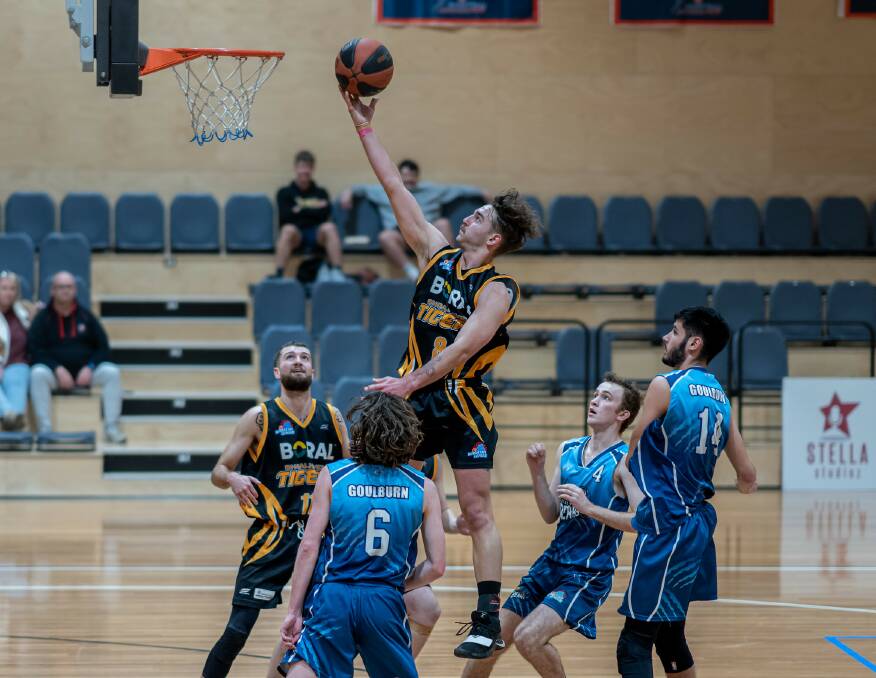 FLYING HIGH: Tigers' guard Brayden Morris laying in two of his 17 points on the day against the Bears. Picture: Shoalhaven Basketball Association.