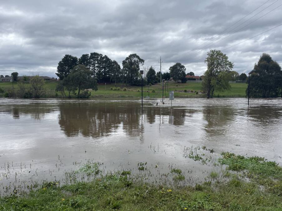 The Gibson Street bridge along the Wollondilly River is now completely underwater. Picture by Sophie Bennett