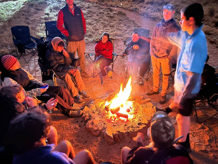 Group members chatting around the fire. Picture supplied