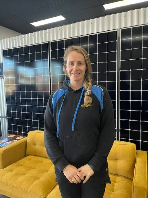 Gabrielle Witenden with some of Goulburn Solar's panels. Picture supplied