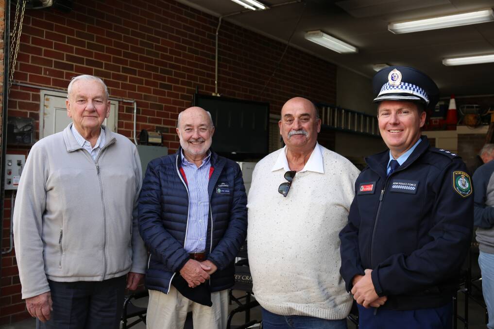 Retired police officers Ray Strong and Greg Moore with Goulburn Mulwaree Council mayor Peter Walker and Inspector Matt Hinton. Picture by Sophie Bennett