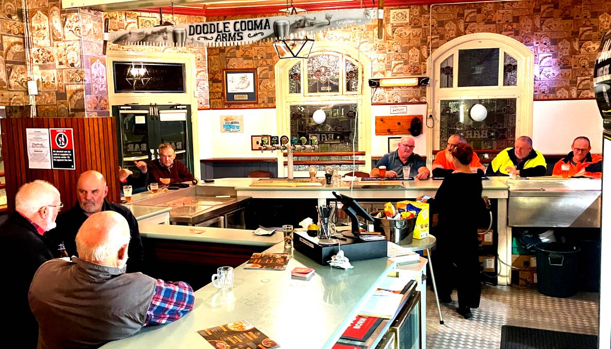 Patrons at the Doodle Cooma Arms Hotel pictured a week after the classic pub's "soft opening" on June 21 after being closed since February. Picture by Ted Howes