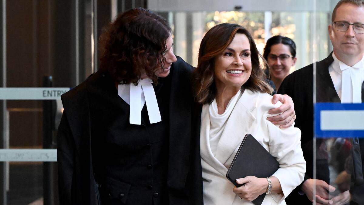 Journalist Lisa Wilkinson, right, with barrister Sue Chrysanthou following Justice Lee's judgment. Picture AAP