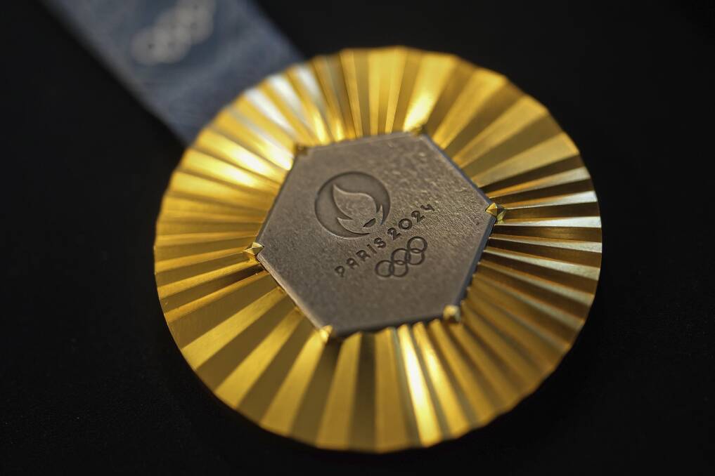 Each medal at Paris 2024 Olympics features a hexagonal, polished piece of iron taken from the Eiffel Tower. (AP Photo/Thibault Camus)