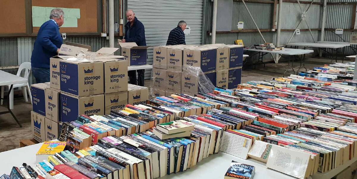 Rotary Club of Goulburn volunteers are sorting thousands of books at Peden Pavillion. Photo supplied.