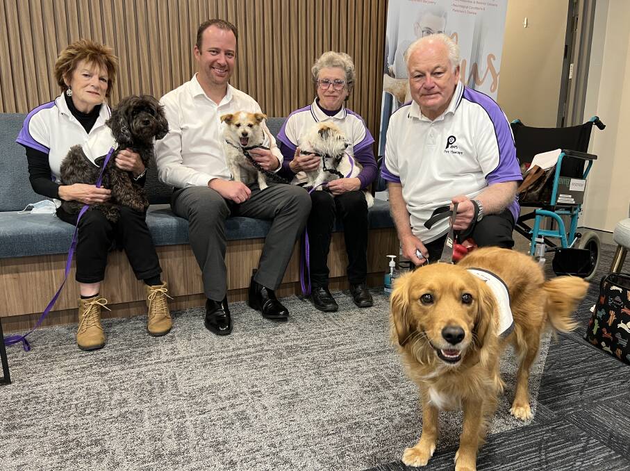 Paws Pet Therapy volunteers Wendy Curry, Gwen Bullard and Dave Barbuto with Southern Highlands Cancer Centre CEO Dean Englefield. Picture by Sally Foy.