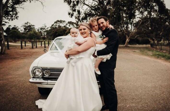 Jessica Tate with Beau Tate, Eloise and Ruby in front of their HR Holden. Photo Supplied.