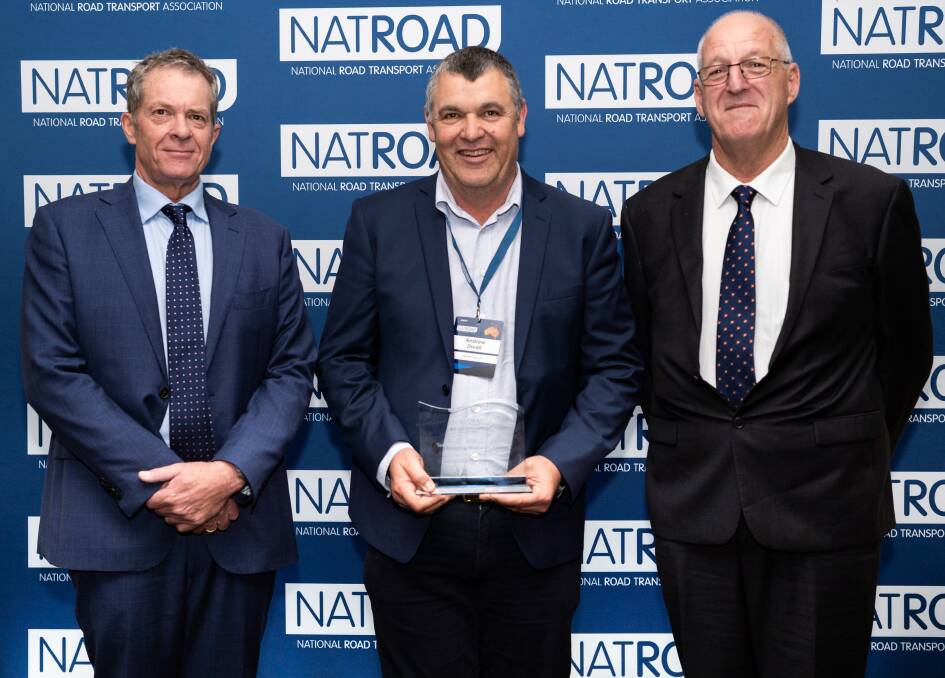 Ted Pickering Memorial Award winner Andy Divall with NatRoad CEO Warren Clark and Roger Pickering. Photo supplied. 