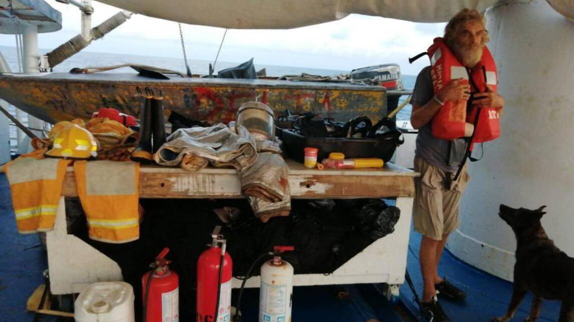 Timothy Shaddock and dog Bella on the Mexican fishing boat that saved them. Picture via Atn Tuny