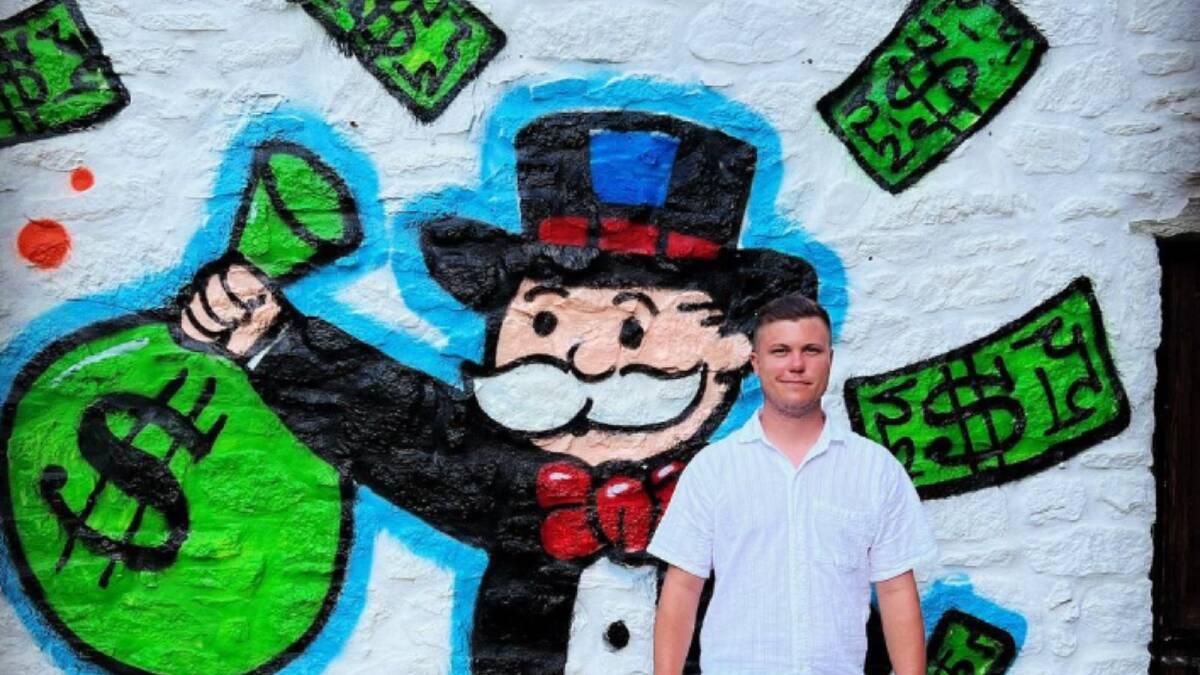 Tyson Robert Scholz in front of Monopoly man street art in Mykonos in September 2022. Picture Instagram