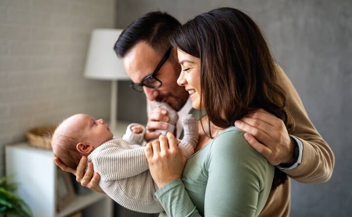 Parents hold their newborn. Picture Shutterstock