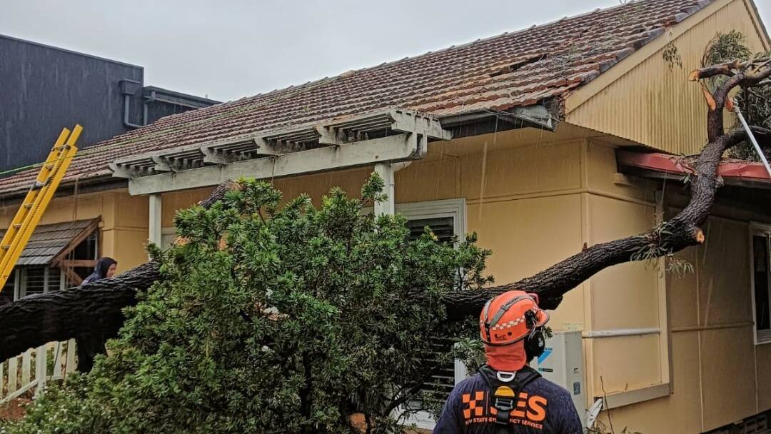 A home is damaged by a fallen tree branch. Picture by NSW SES