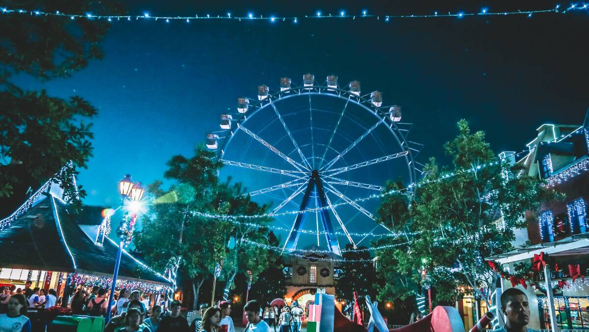 Spend your weekend at a neon themed carnival. Image by Pexels. 