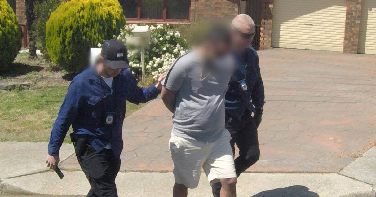 Police take an alleged offender into custody. Picture NSW Police