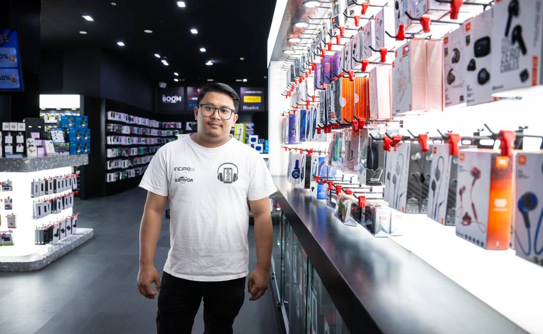 Dr Boom Communications technician Sachin Sahrestha is hoping customers will spend big during the Black Friday sales. Picture by Sitthixay Ditthavong