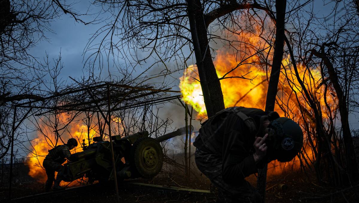 Ukrainian servicemen fire a D-30 Howitzer towards Russian infantry along the frontline outside of Soledar. Picture Getty Images