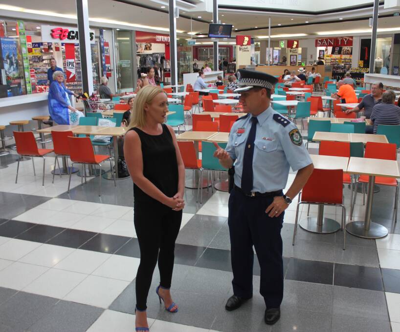 SQUARE SAFETY: Retail manager for Goulburn Square, Natalie Young, talking with Hume LAC Detective Inspector Chad Gillies. The shopping centre's 12-month ban aims to deter anti-social behaviour. Photo: Mariam Koslay
