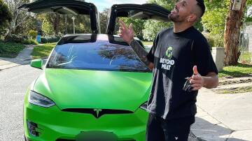 Nick Kyrgios with his Tesla that was stolen in 2023. Picture Instagram