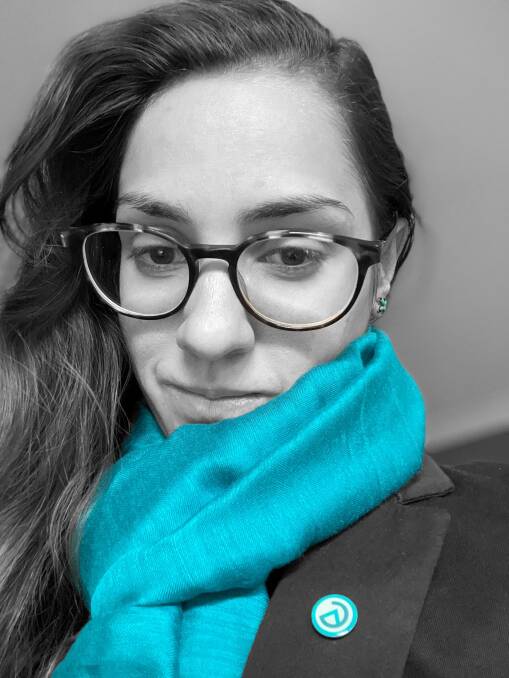 ACM supervising producer Emma Horn decked out in teal for World Ovarian Cancer Day on May 8. This is the colour of 'ovary-action'.
