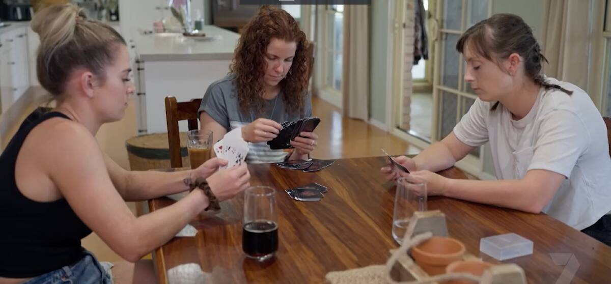 Brushing up on the national sport for waiting wives, Todd's girls rip into an intense game of, ironically, Old Maid. Picture supplied