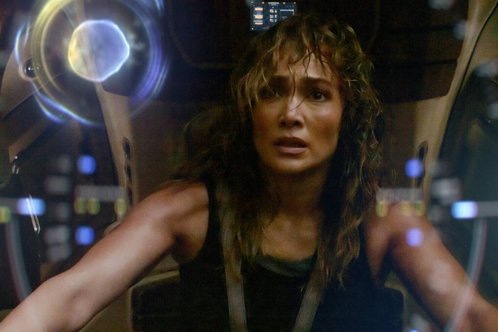 Jennifer Lopez stars in sci-fi action film Atlas while, below, members of the Blue Angels team leave their jets in The Blue Angels. Pictures by Netflix, Prime Video