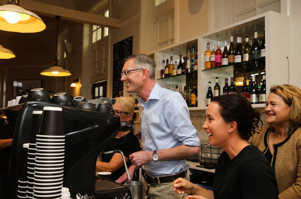 Premier Dominic Perrottet helped serve up coffee during a visit to Goulburn's Roses Cafe on Tuesday. Picture by NCA NewsWire/ Gaye Gerard. 