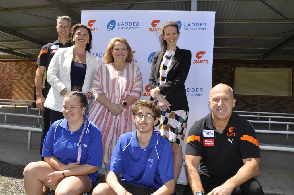 Ladder Step Up western Sydney participants Aisha Gillespie and Tiago Gigi-Correia with Western Sydney Giants head of Canberra operations, Jack Masters (and rear), AFL NSW/ACT community football regional manager, Steve Mahar, Minister Natasha McLaren Jones, Goulburn MP Wendy Tuckerman and Ladder CEO, Stephanie De Campo at this week's funding announcement. Picture by Louise Thrower.