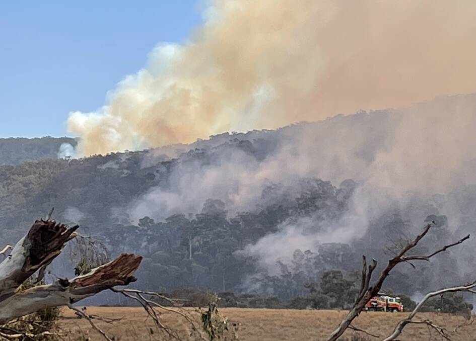 Aerial incendiary capsules were dropped over the fire's north-eastern sector on Sunday. Jerrong Road resident, Anne Capplis captured this image to the northwest of her property.