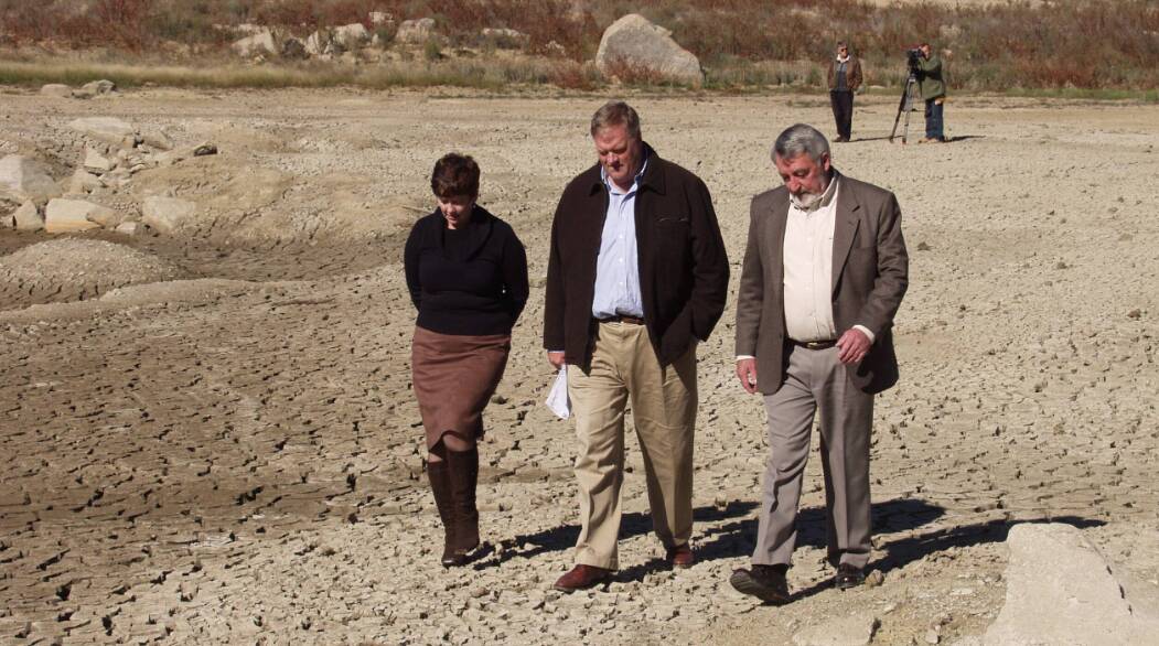 Former senator for NSW, Ursula Stephens, then water minister, Kim Beazley and former Goulburn Mulwaree mayor, Paul Stephenson walk across a dry Pejar Dam in 2005. Picture by Peter Oliver.