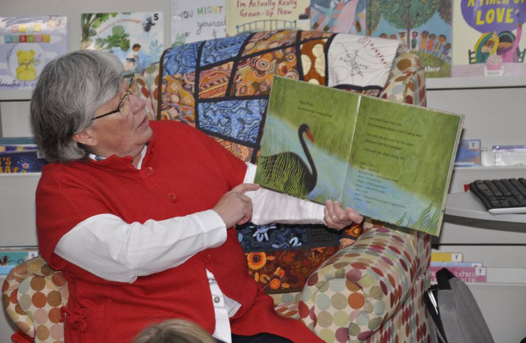 Muffy Hedges, a proud Darug woman, had children entranced as she read stories about animals and their Aboriginal names. Picture by Louise Thrower. 
