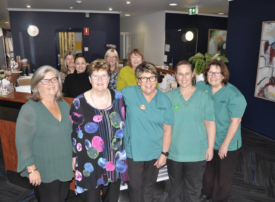 Dr Margaret Beevors with Goulburn Medical Clinic practice manager, Maree Stapleton (left), office and nursing staff. Picture by Louise Thrower.