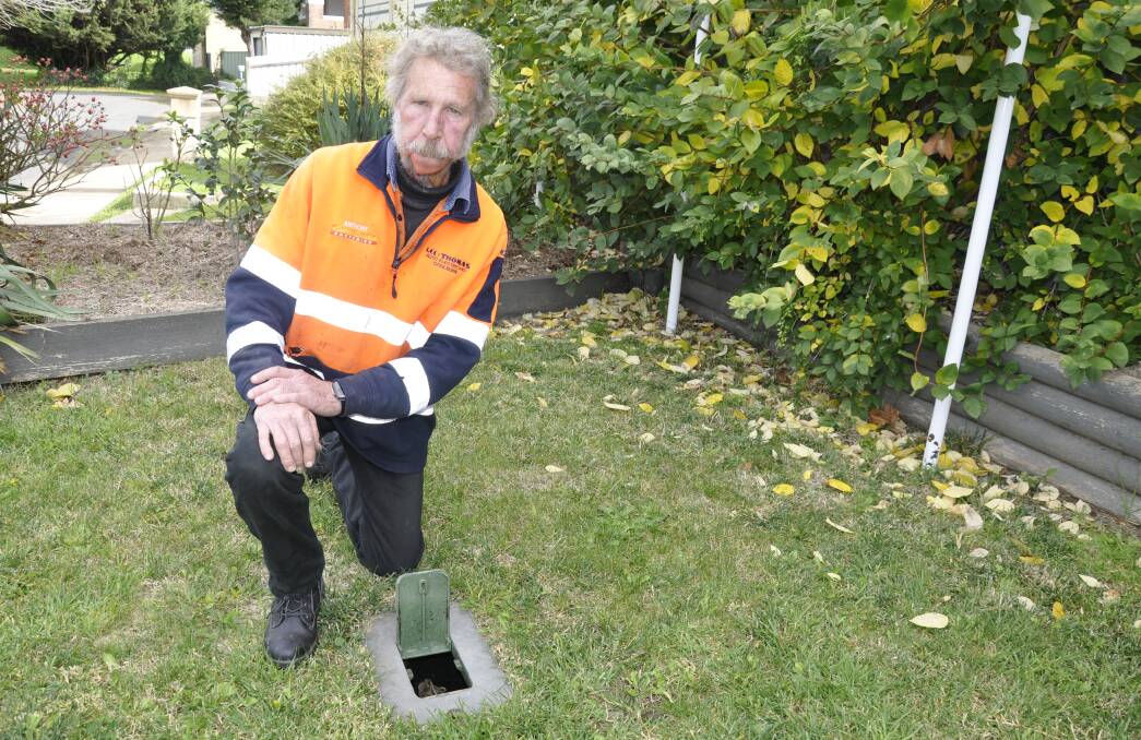 Anthony O'Neill, pictured at his home's water meter, said "commonsense had prevailed" regarding his high water bill. Picture by Louise Thrower.