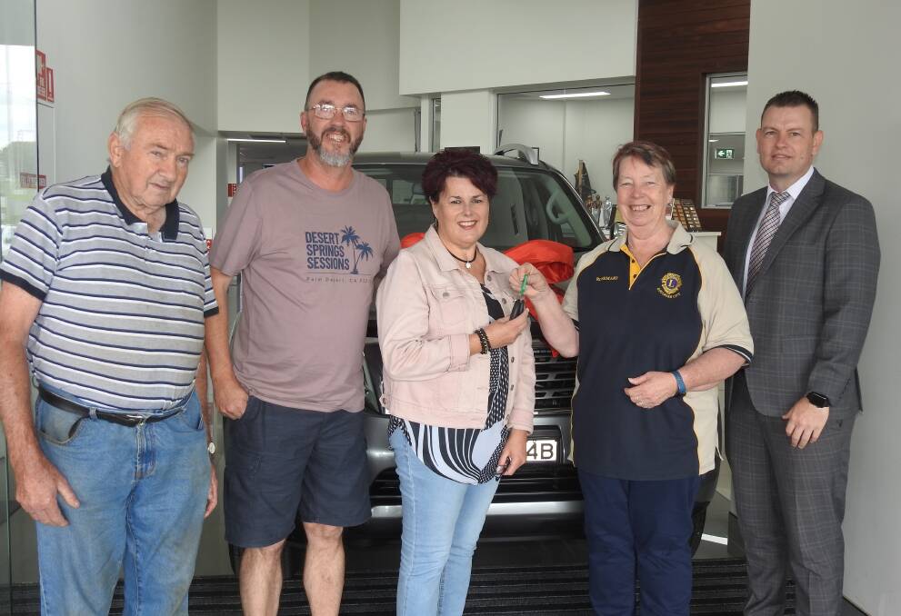 CHUFFED: Lions Club raffle winner Nicole Apps (third left) was thrilled to accept the keys to her new Nissan Navara from president Rosemary Chapman and Country Motors general manager David Albrighton. Lions past president Alex Harmer and Nicole's partner, Rob, were also on hand. Photo supplied.