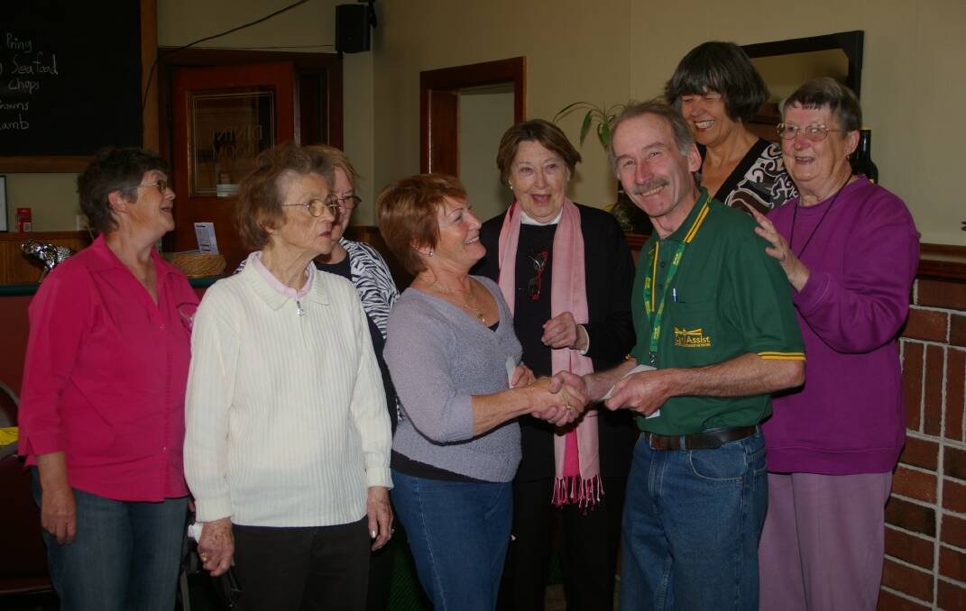 CanAssist president, Ian McMurdo, accepted a generous donation from the Goulburn Breast Cancer Support Group, led by Loz Westley, soon after the branch's formation. Picture by Louise Thrower. 