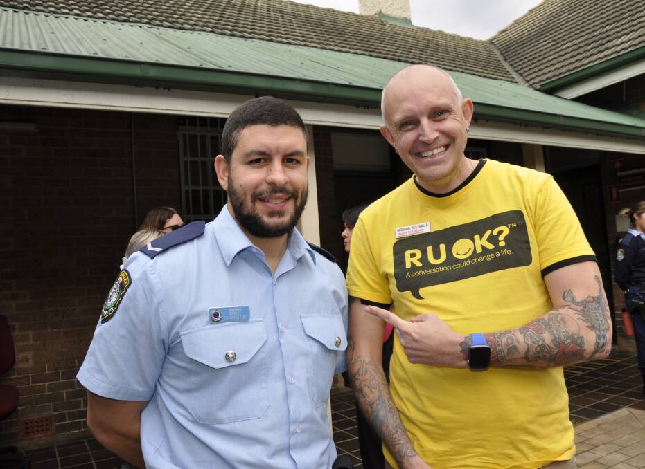 Constable Daniel Carrington caught up with Mission Australia area manager, Daniel Strickland at the RUOK barbecue at Goulburn Police Station on Thursday. Picture by Louise Thrower.