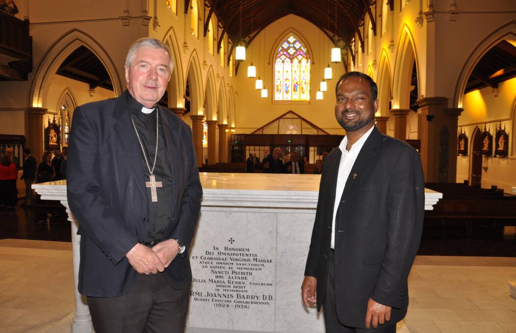 Archbishop of Canberra/Goulburn, Christopher Prowse and Mary Queen of Apostles parish priest, father Joshy Kurien inside the restored Sts Peter and Paul's Cathedral during a preview tour on Friday. The $10 million restoration project will officially open on Wednesday, November 30. Picture by Louise Thrower. 