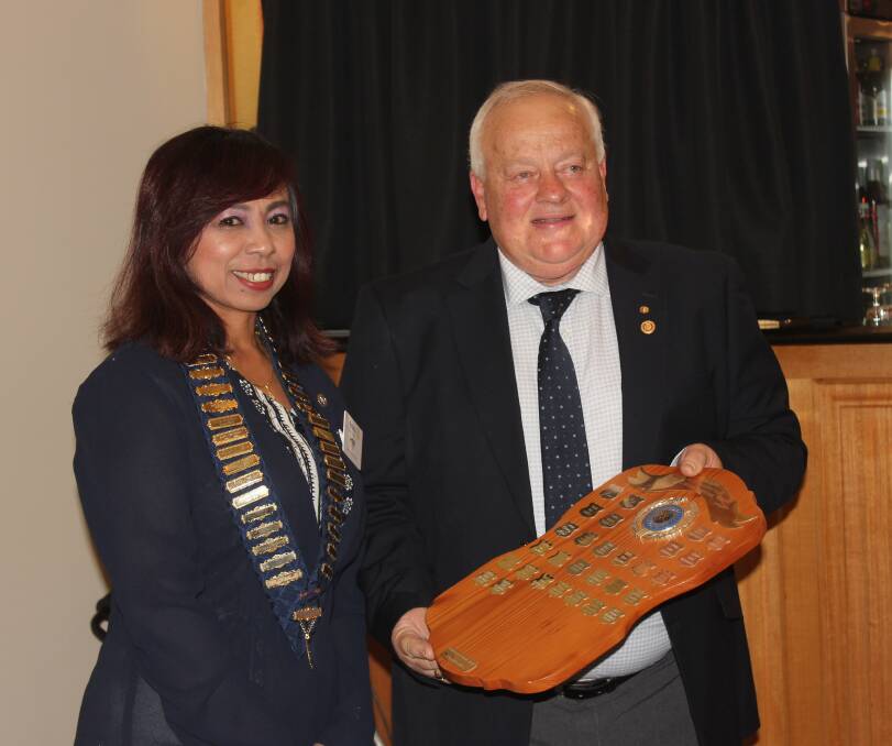 Heni Hardi presented Ted Kadziela with the Goulburn Argyle Rotary Club's Bob McMahon achievement award in 2019. Picture by David Cole.