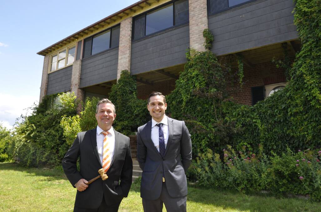 Bowral-based Hugh Hanrahan from Cooley Auctions and real estate agent, John Connell at Saturday's auction of Goulburn property, 'South Hill.' Picture by Louise Thrower.