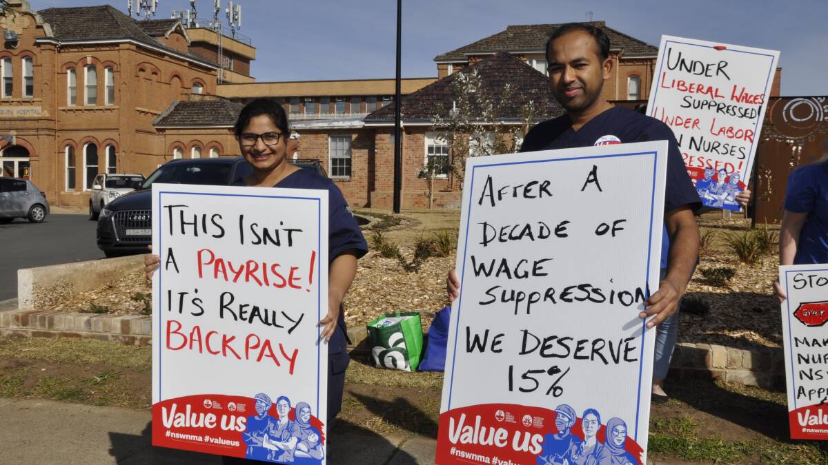 Registered nurses Jenny Kuruvilla and Eldho Varghese conveyed a message at the rally. Picture by Louise Thrower. 