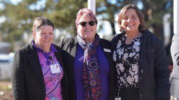 Inland network Aboriginal Health manager, Marion Knight, Ngunnawal woman, Jennie Gordon, and Goulburn Base Hospital site manager, Kylie Strong, raised the flag at the new Aboriginal Health Centre's opening. Picture supplied.