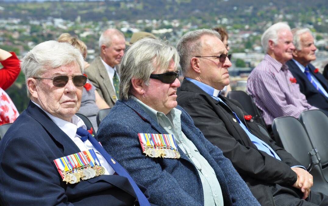Donald Thomson and son, Grant, were among those paying their respects. Picture by Louise Thrower.