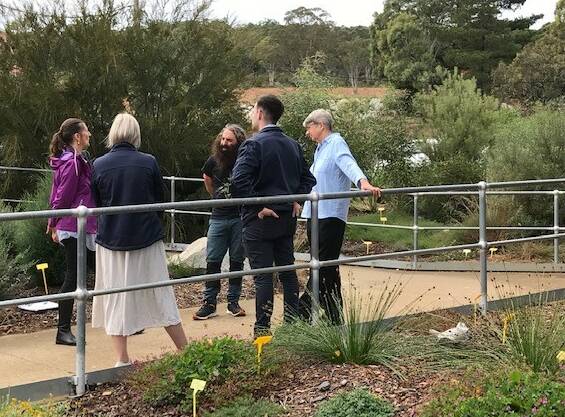Gardening Australia host Costa Georgiadis and his producer (left) chat with Goulburn Mulwaree Council Visitors Centre staff and FROGS volunteer, Pauline Husen (right). Picture supplied.