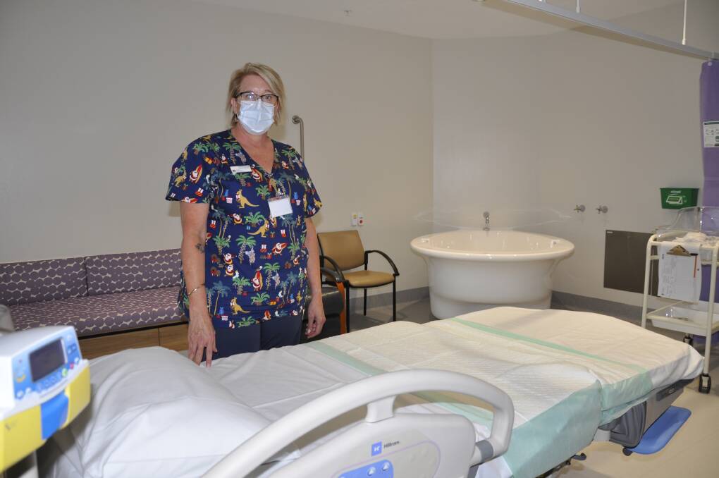Goulburn Base Hospital nurse/midwifery manager, Felicia King, shows off the birthing suites, complete with adjustable bed and large bath. Picture by Louise Thrower.