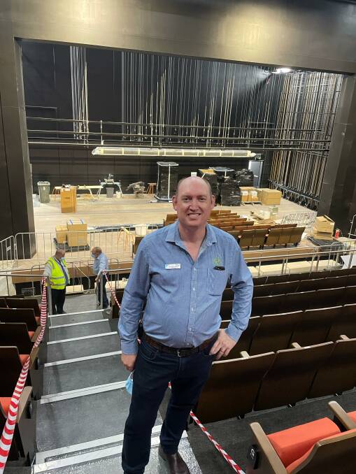 Cr Andy Wood at Goulburn Performing Arts Centre when it was nearing completion in February, 2022. The fly tower is shown in the background. Picture supplied.